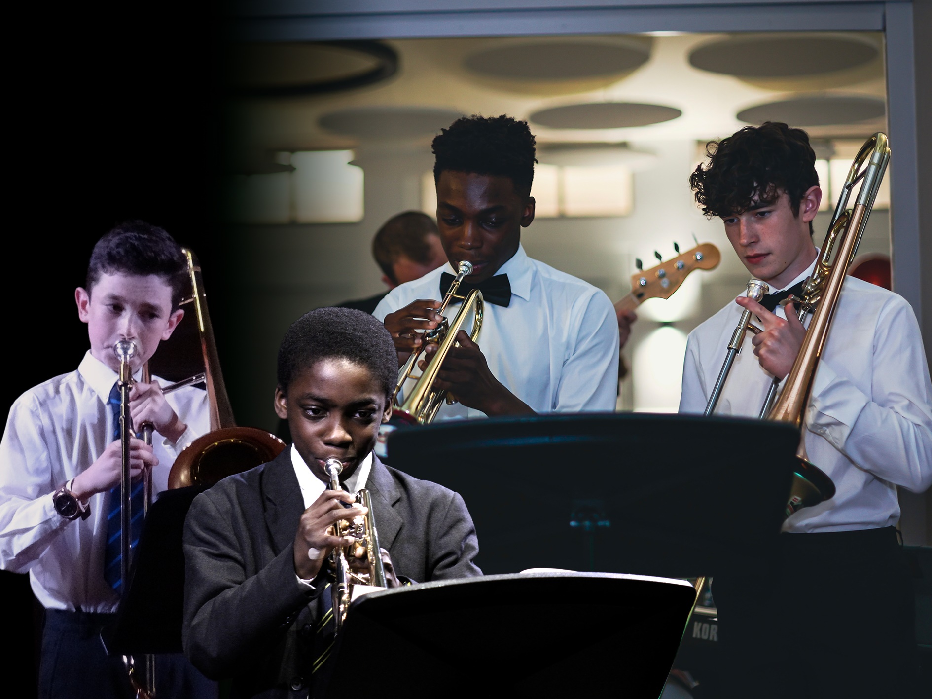Four boys playing brass instruments, including trumpets and trombones, dressed in formal shirts and ties, performing on stage with music stands, under indoor lighting.