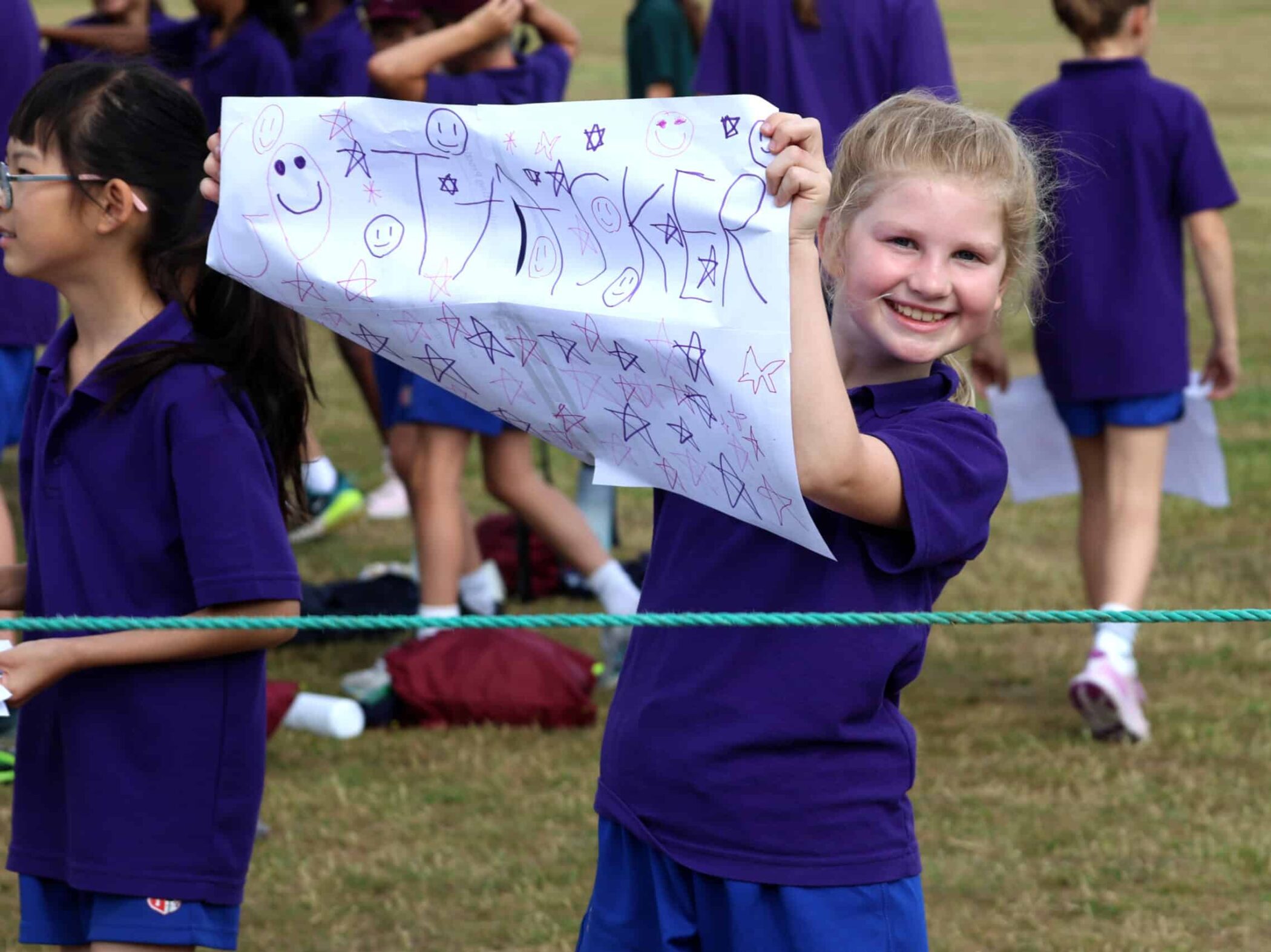 A girl holding a sign.