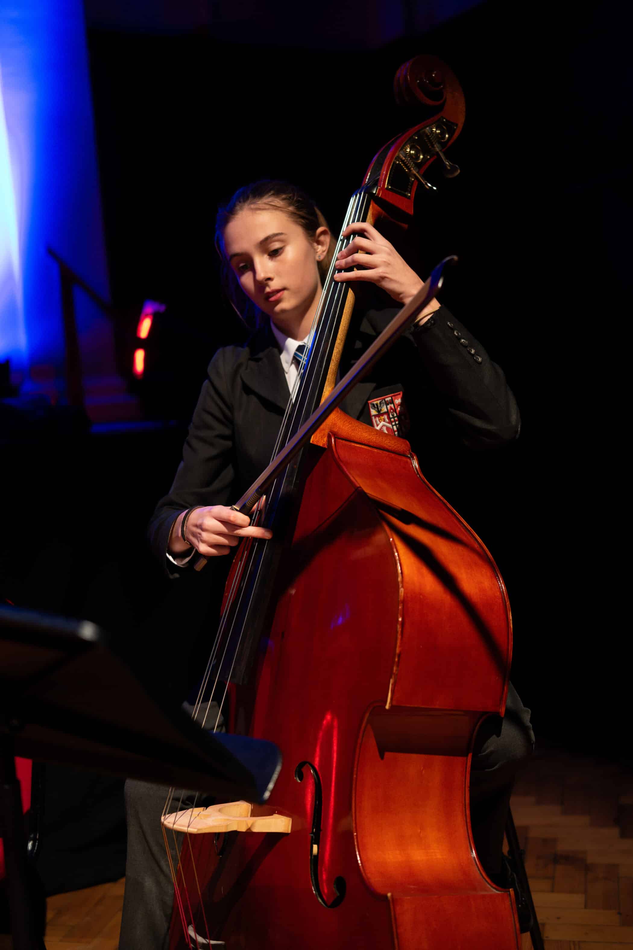 A girl playing a violoncello.