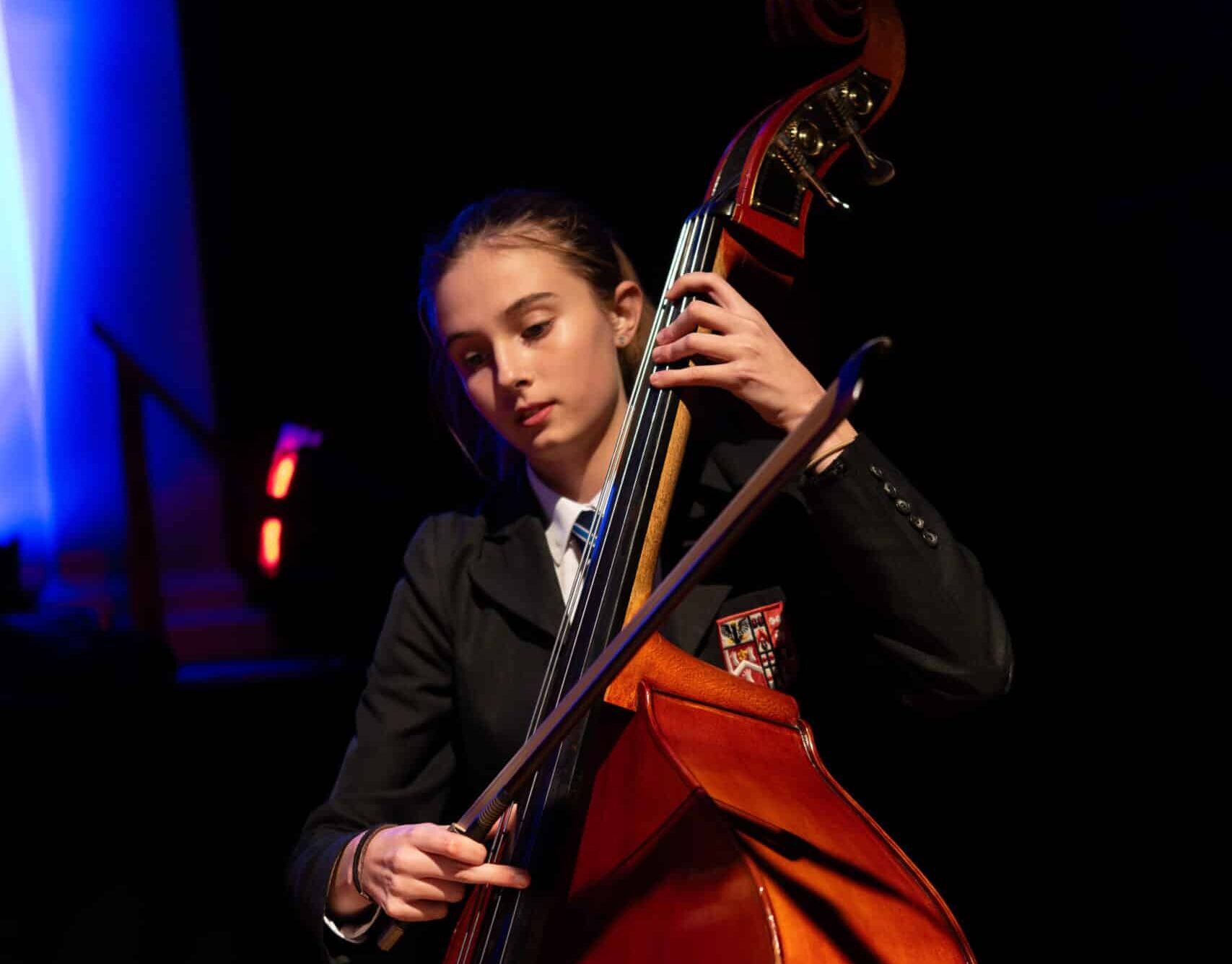 A girl playing a violoncello.