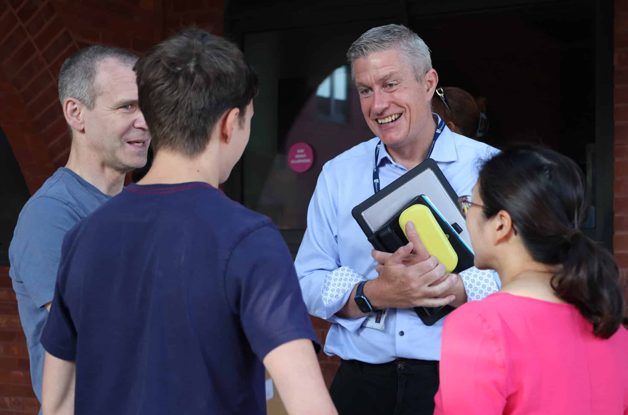 Heads' Blog photograph of Michael Bond, Headmaster talking to a family at Brentwood School