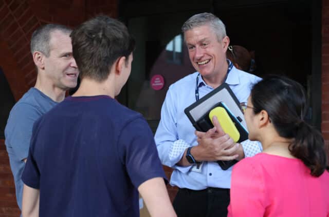 Heads' Blog photograph of Michael Bond, Headmaster talking to a family at Brentwood School
