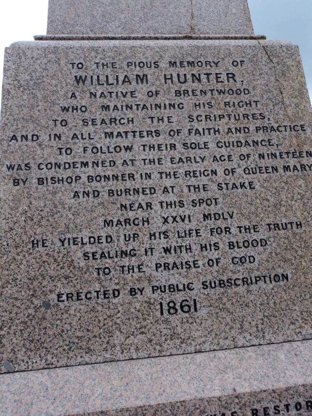 Inscription on a stone monument commemorating William Hunter, who was burnt at the stake in 1555 for his faith. The text honours his sacrifice and notes the monument was erected by public subscription in 1861.