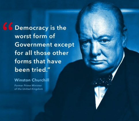 Portrait of Winston Churchill in a suit and bow tie beside his quote: “Democracy is the worst form of Government except for all those other forms that have been tried.” His name and title are written below the quote.