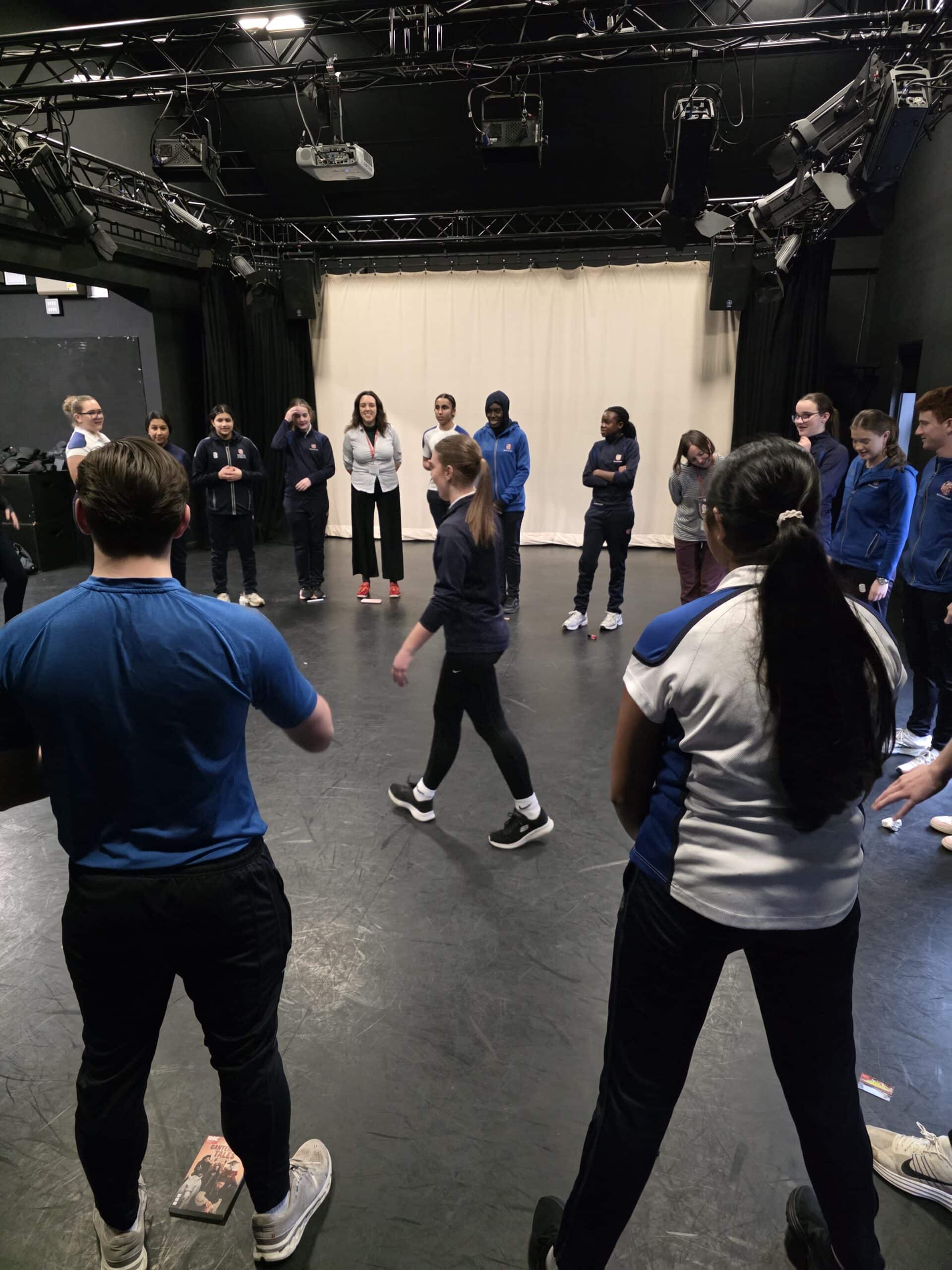 A group of people standing in a circle.