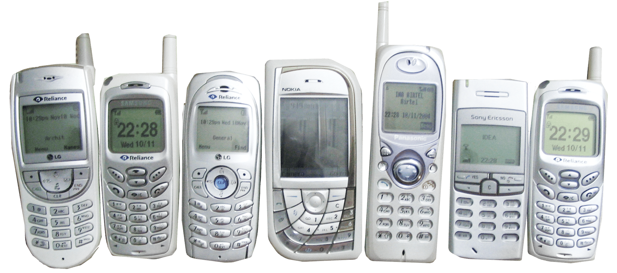 Seven vintage white mobile phones from different brands are lined up side by side, each with physical keypads and small screens displaying basic information. The phones have distinct designs and visible aerials.