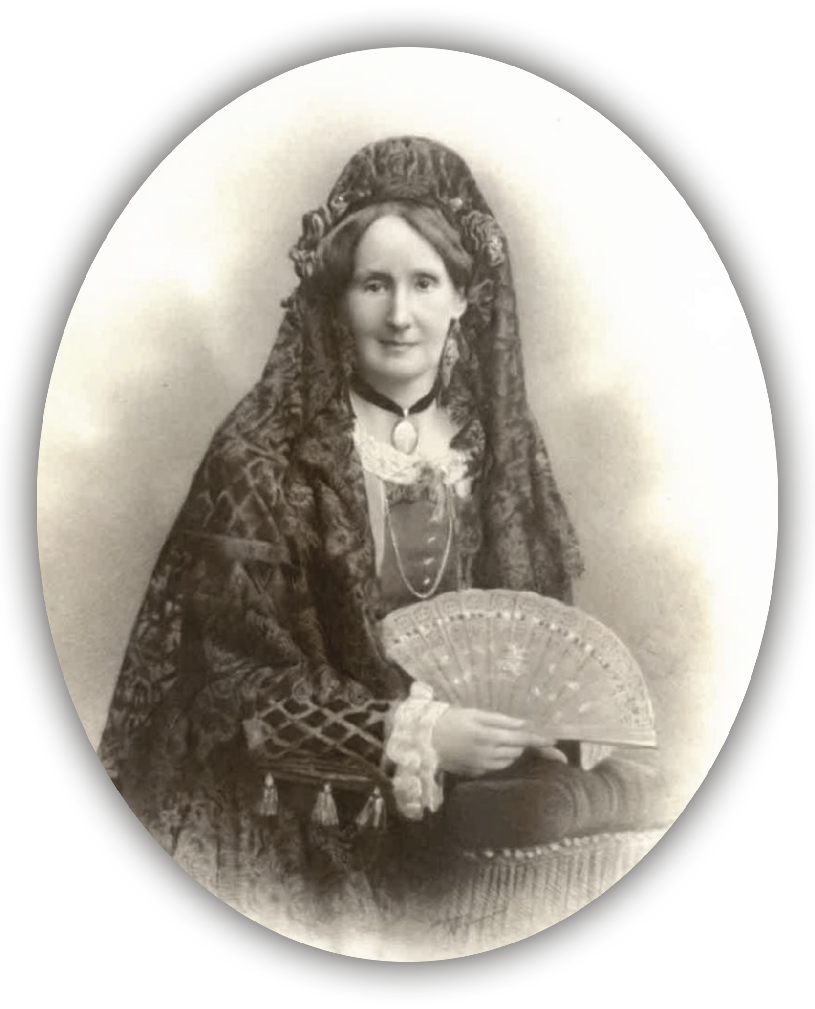 A sepia-toned, vintage portrait of a woman dressed in elaborate, traditional clothing, including a shawl and head-dress, holding an ornate fan and gazing calmly at the camera.